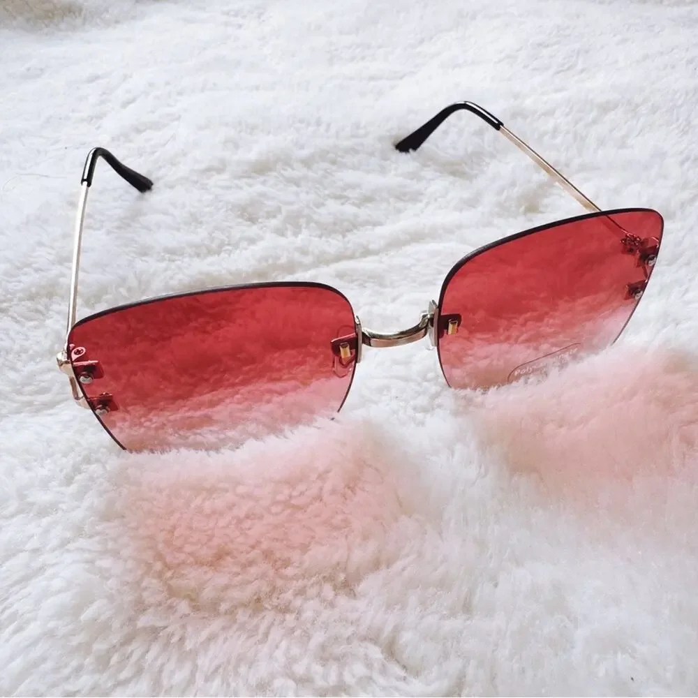 Laurel Clear Orange Rimless Sleek Sunglasses